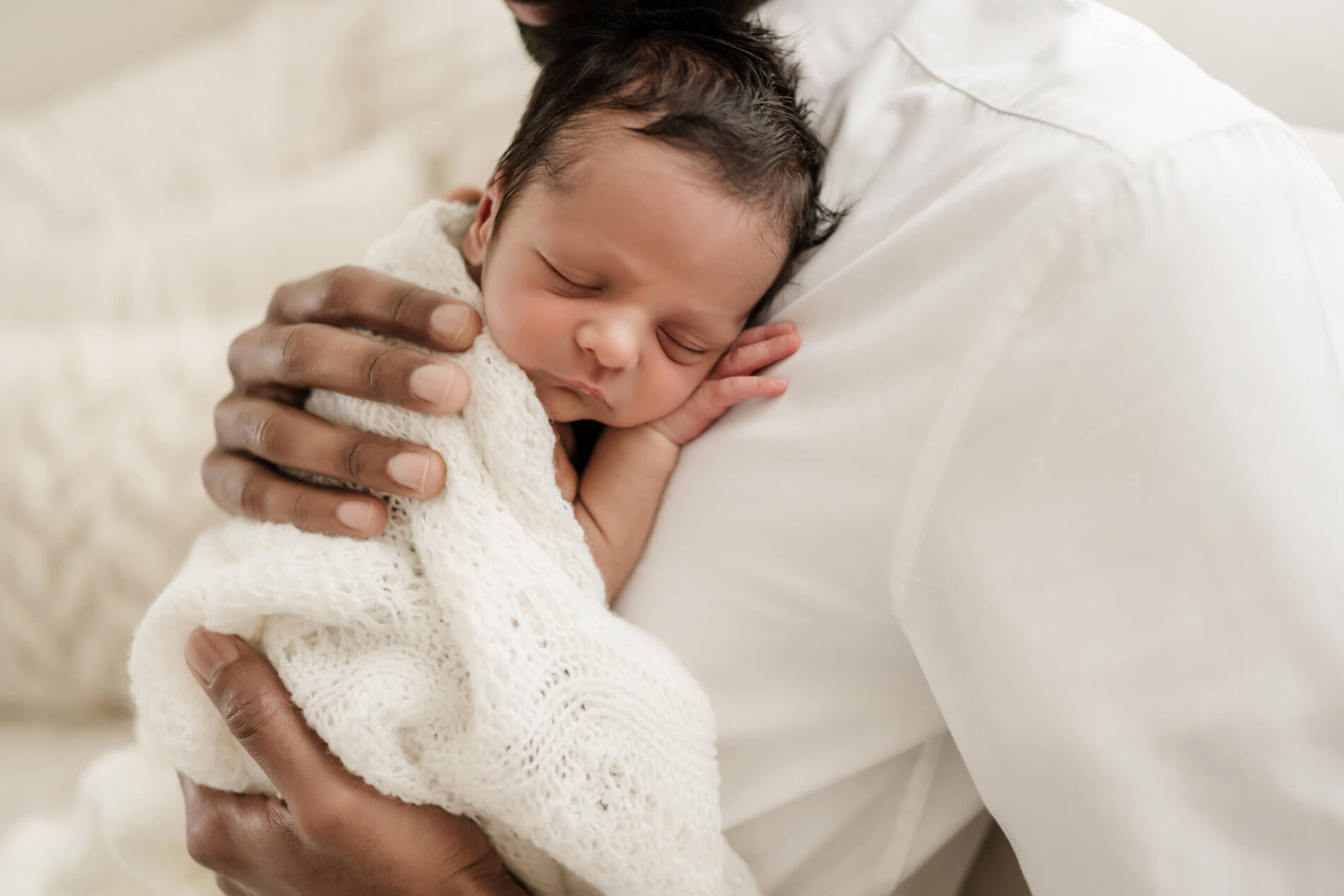 Tender moment during a newborn photoshoot