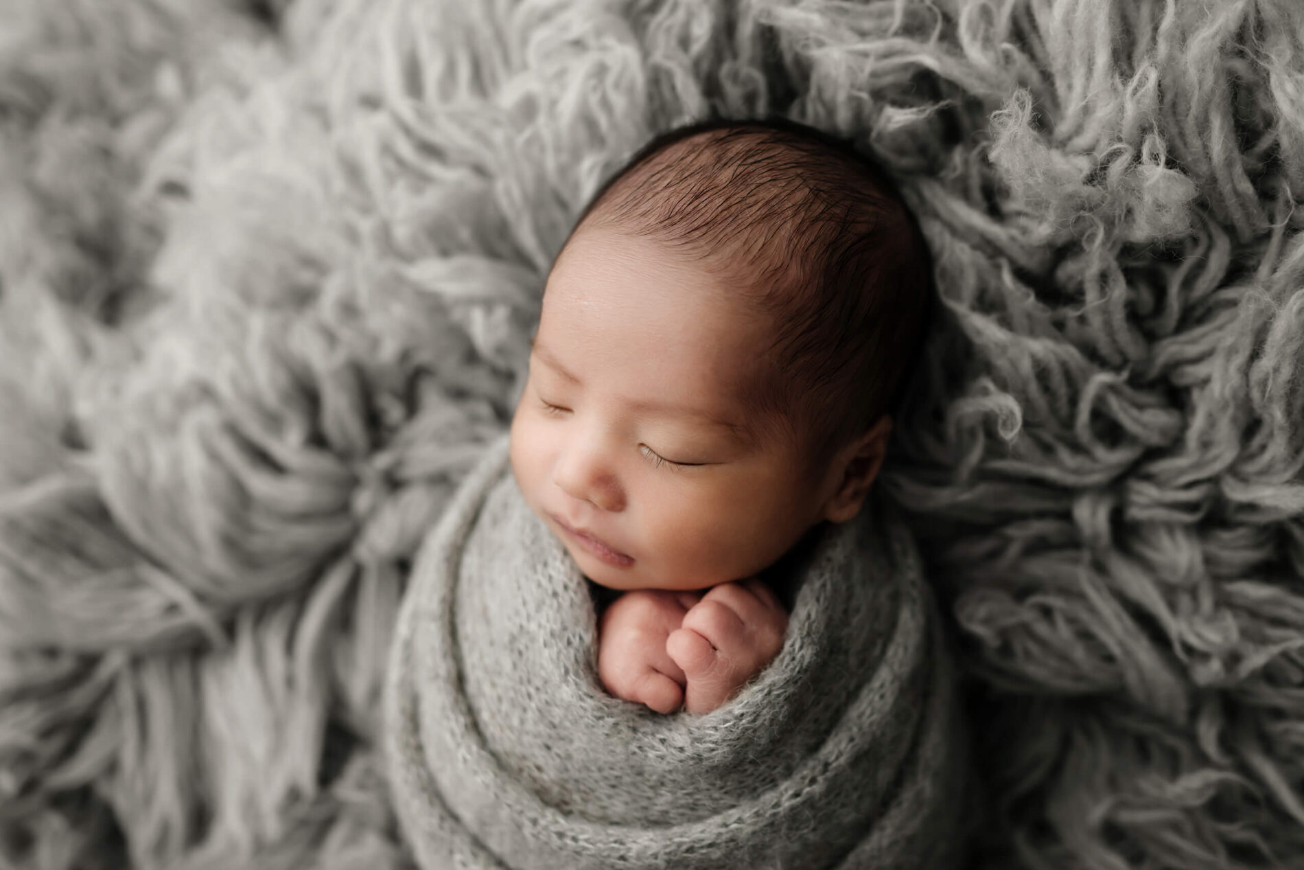 Wrapped newborn portrait of a boy taken in my studio near Bothell WA