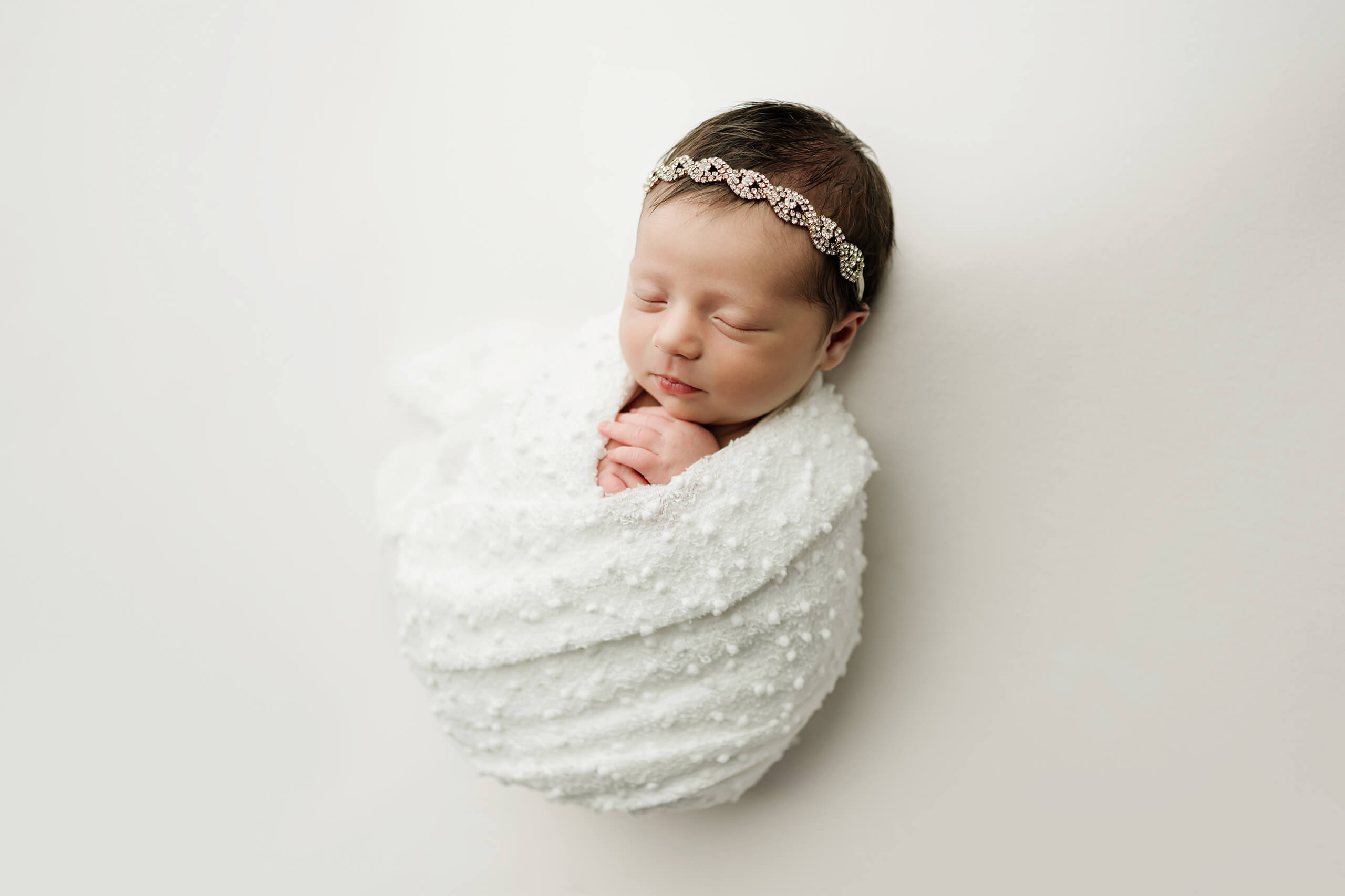 Timeless newborn portrait of a girl