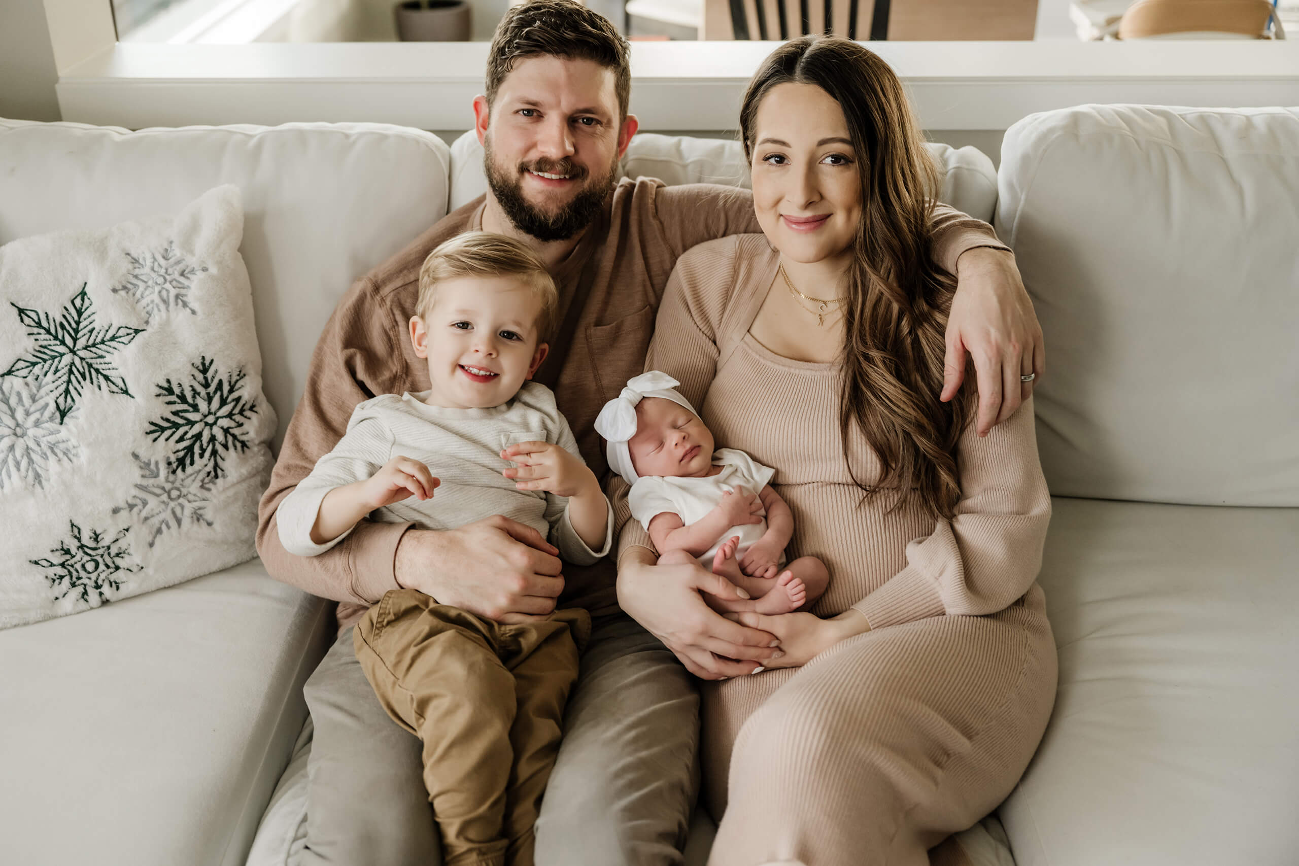 Lifestyle newborn portrait of a family of four