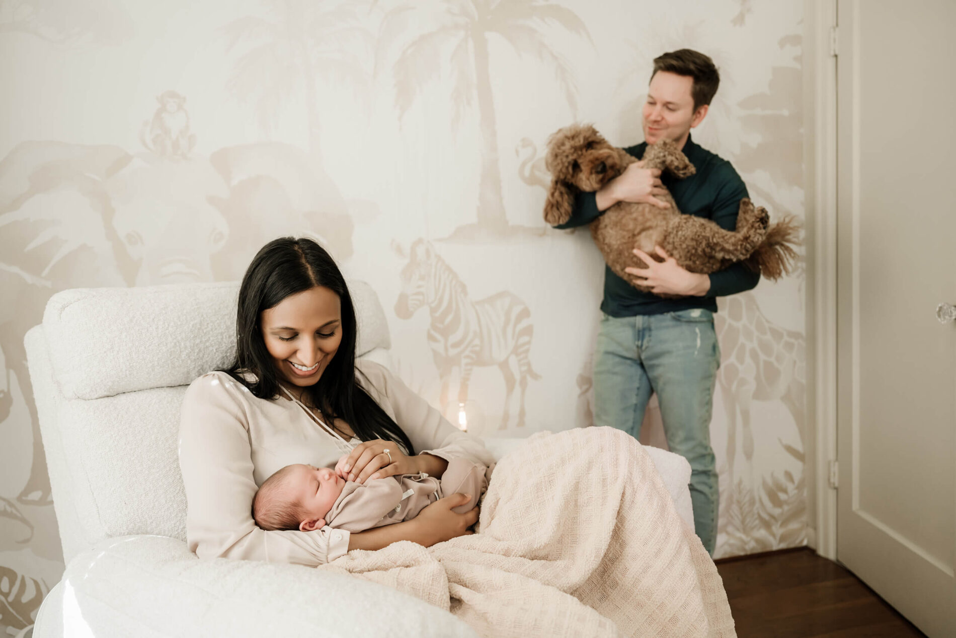 Family lifestyle newborn portrait in a nursery