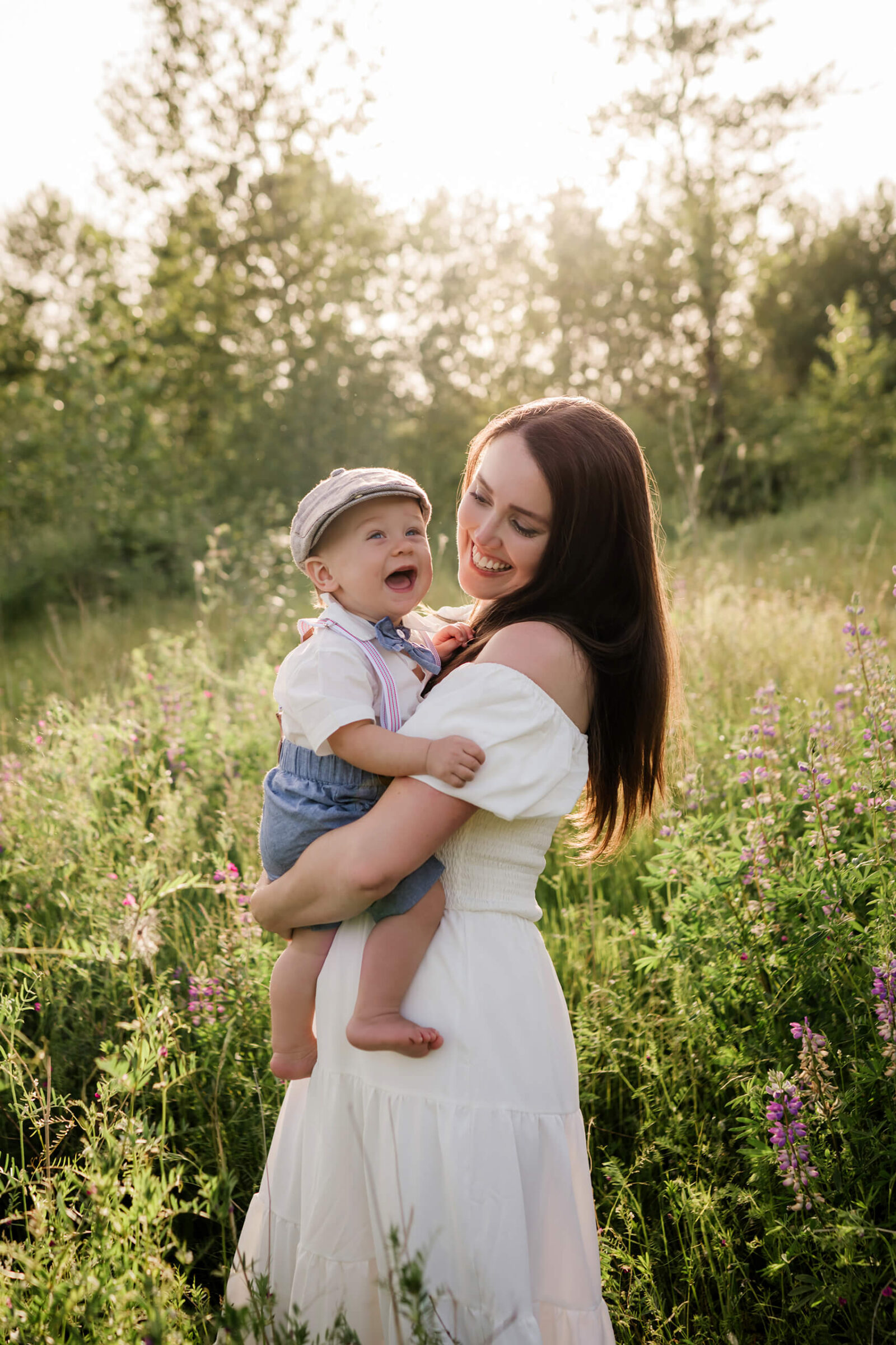 Mom hugging with son in a lupine field during Seattle family photoshoot