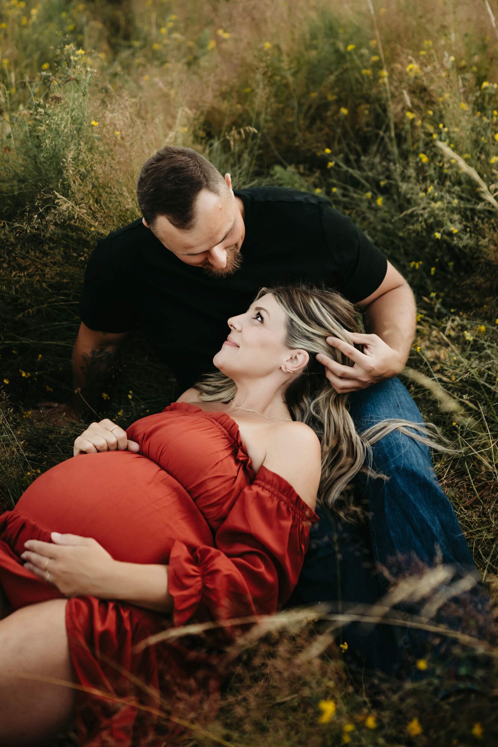 Maternity photoshoot in a field of wildflowers during summer in Seattle