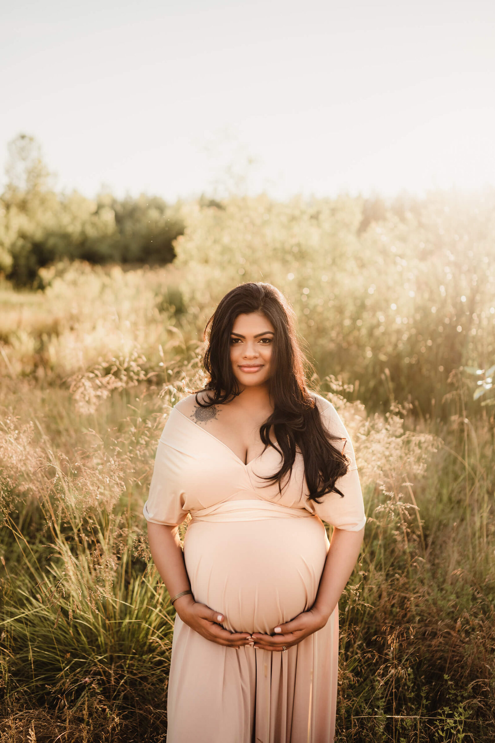 Seattle maternity photoshoot with a pregnant woman in a beautiful gown