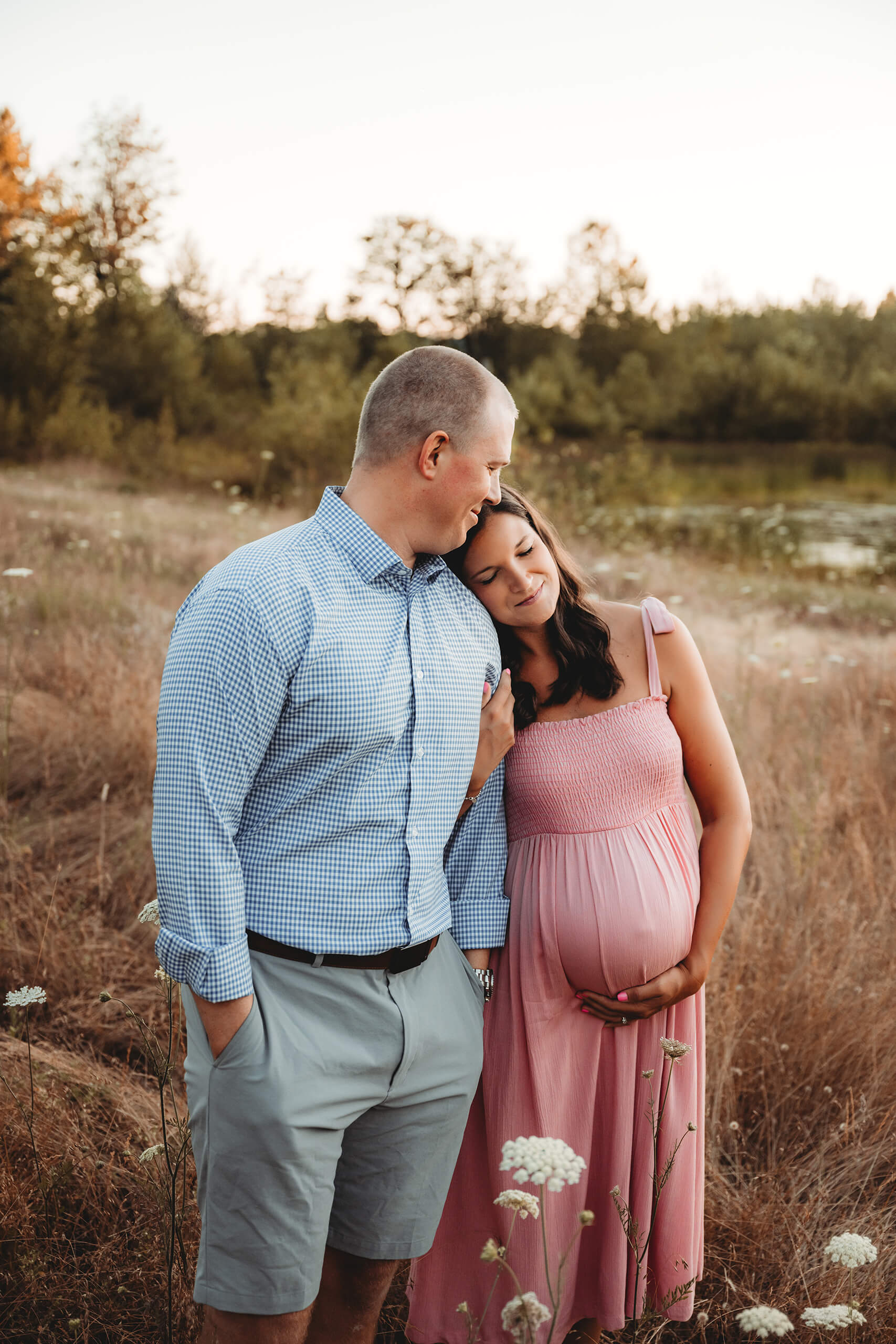 Seattle couples maternity photoshoot in a field during summer