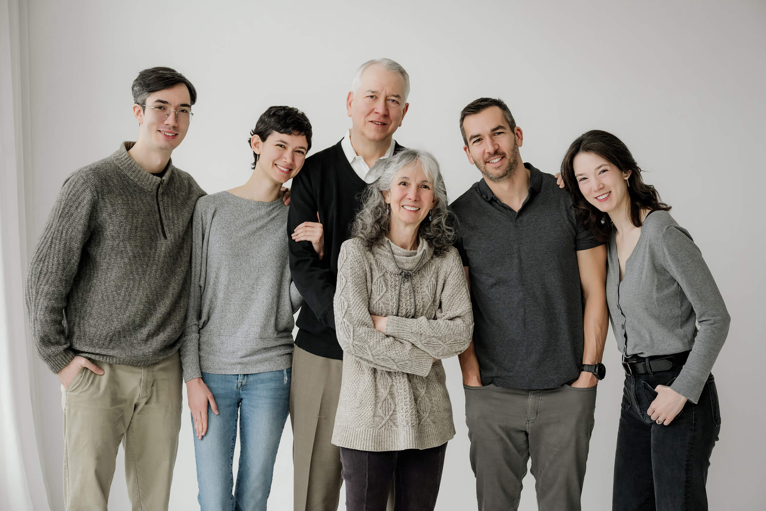 Multi-generational family group portrait photographed in a Seattle family photography studio.