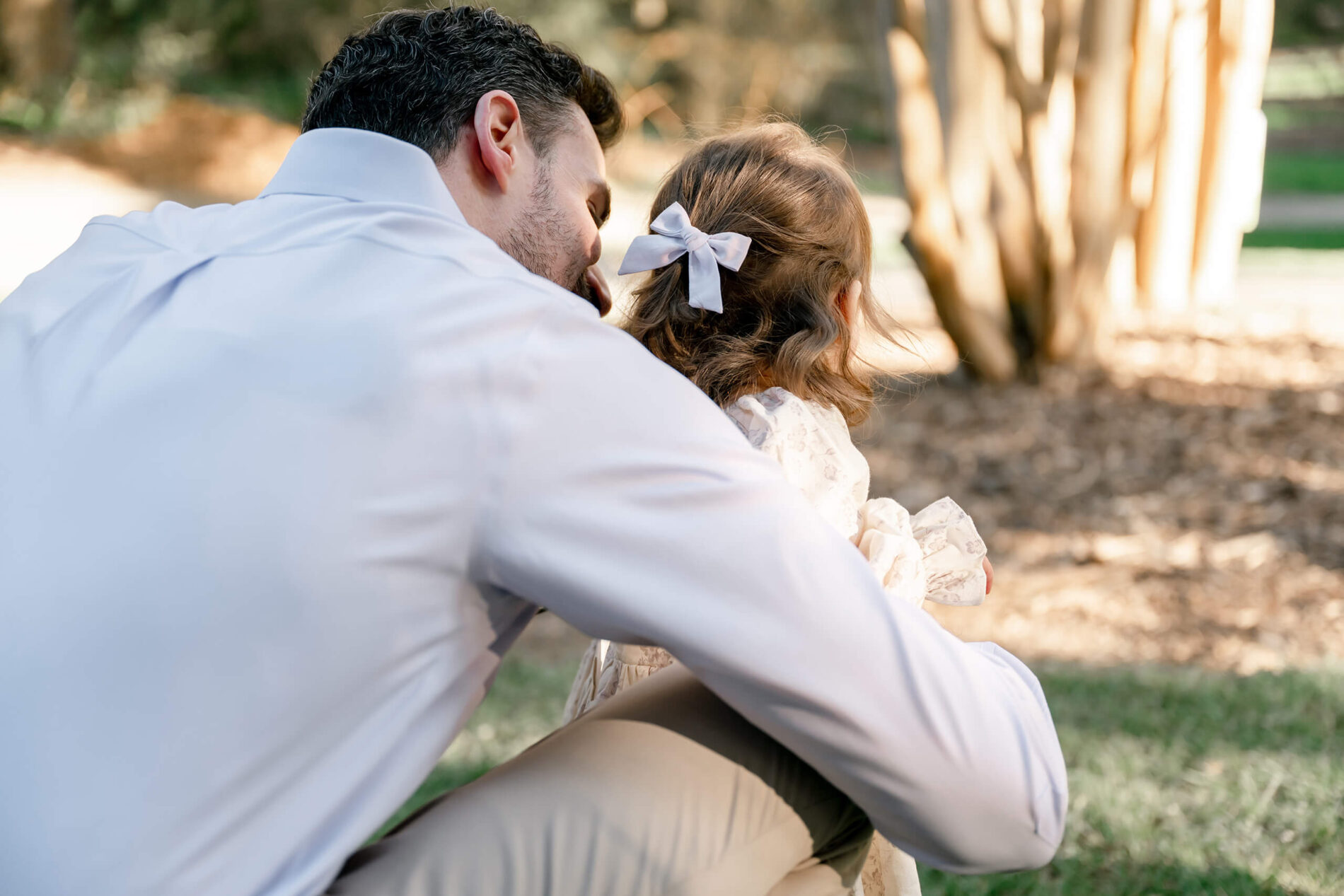 Father and toddler daughter candid portrait during a spring family session in Seattle