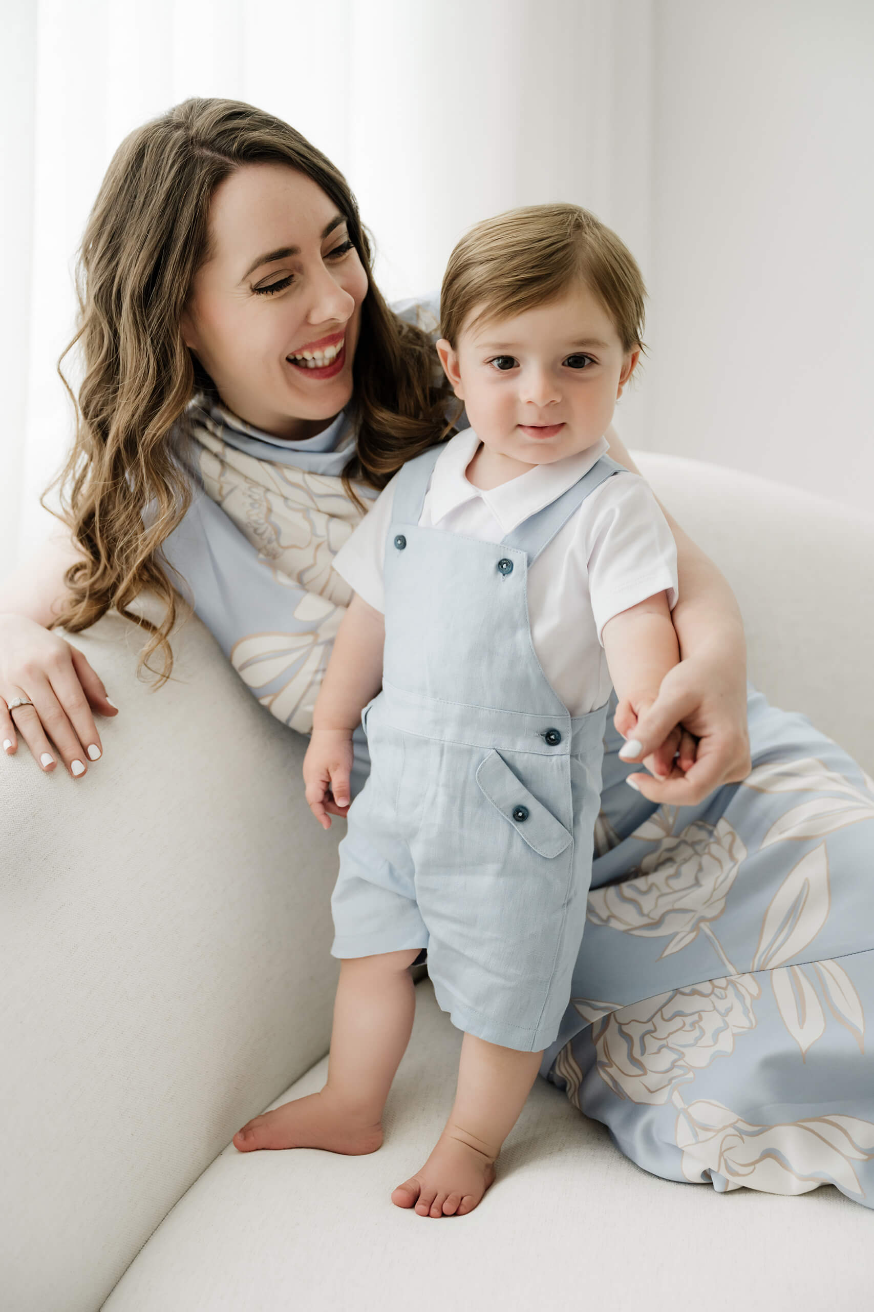 Mother and one-year-old son during a first birthday milestone portrait session at Lana Sky Photography's Kirkland studio.